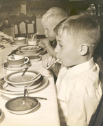 Children of James Barry eating during the Golden Jubilee for Monsignor William Barry